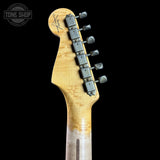 Close-up of a guitar headstock with tuning pegs on a black background, featuring the Tone Shop logo.
