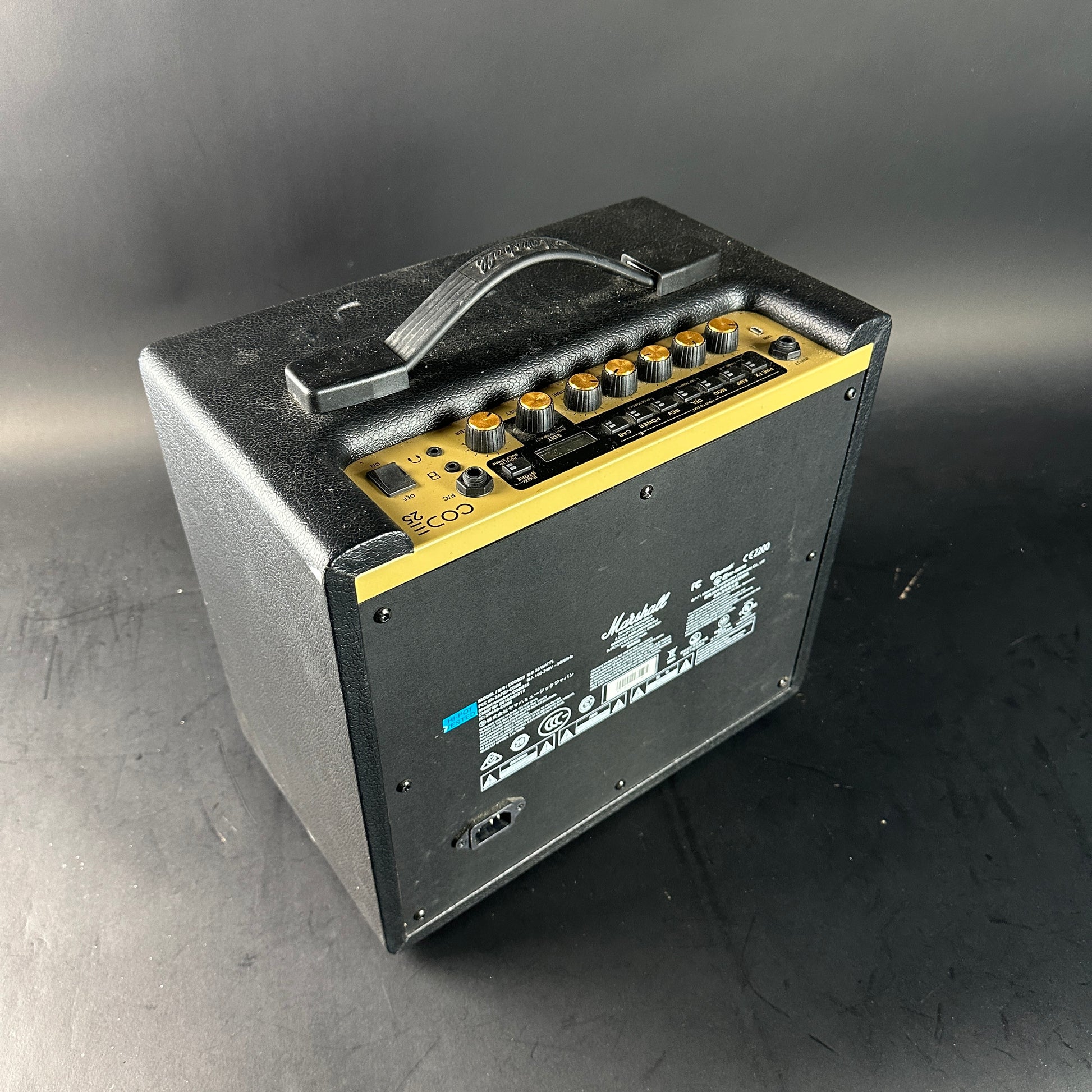 Guitar amplifier with control panel on a gray background