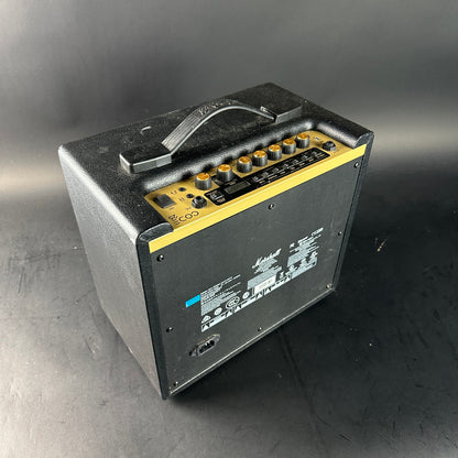 Guitar amplifier with control panel on a gray background