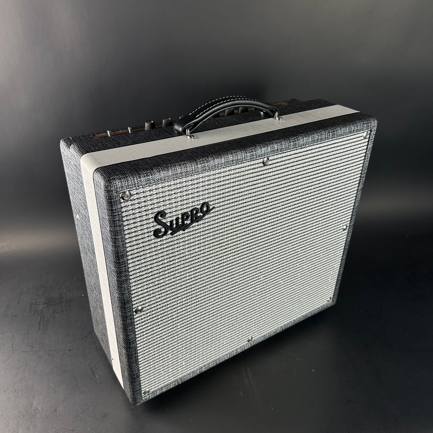 Supro guitar amplifier on a dark background