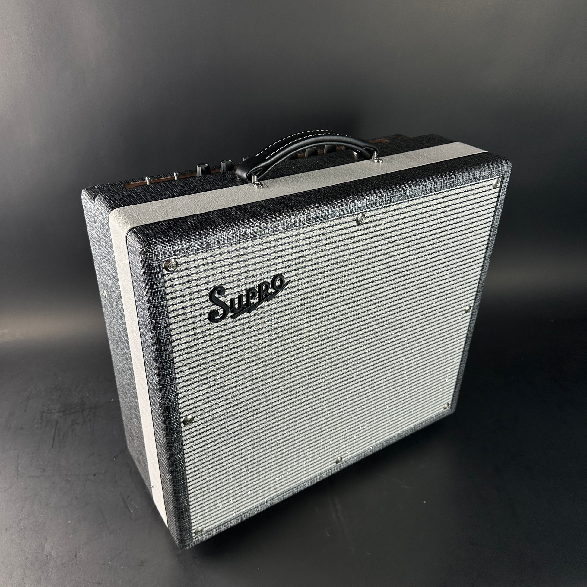 Supro guitar amplifier on a dark background