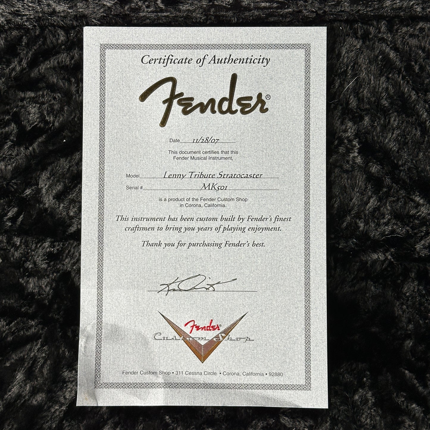 Fender Certificate of Authenticity on a textured black background