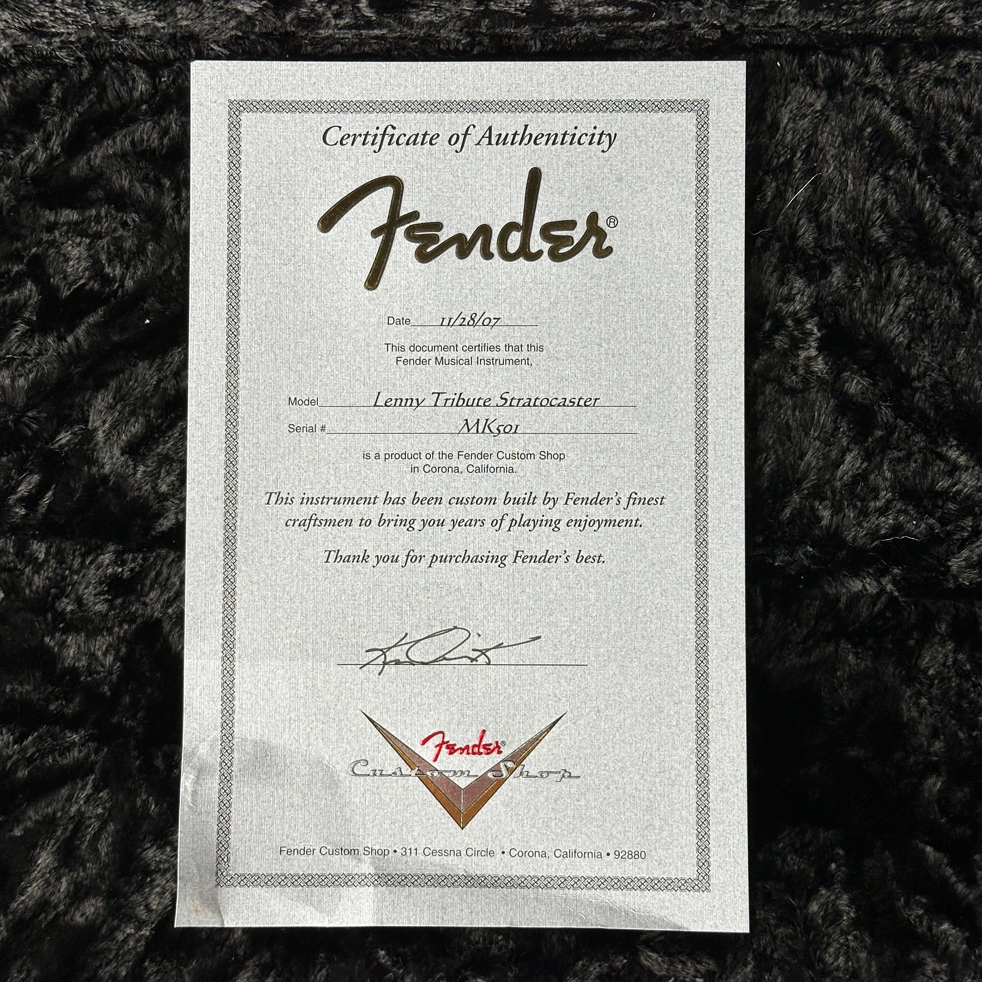 Fender Certificate of Authenticity on a textured black background