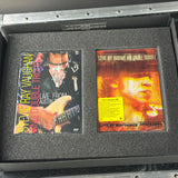 Stevie Ray Vaughan and Double Trouble album covers in a protective case.