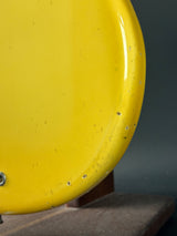 Close-up of a yellow object with a dark background