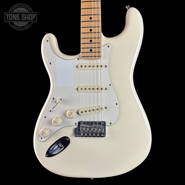 A white electric guitar with a maple neck, featuring a white pickguard, cream-colored knobs, and a black bridge, shown against a solid black background with a Tone Shop watermark in the top left corner.