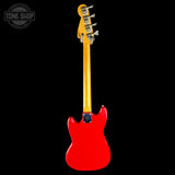 A red electric bass guitar shown from the back against a solid black background, featuring a natural wood neck and headstock with silver tuning pegs. A 'TONE SHOP' watermark is visible in the top-left corner.