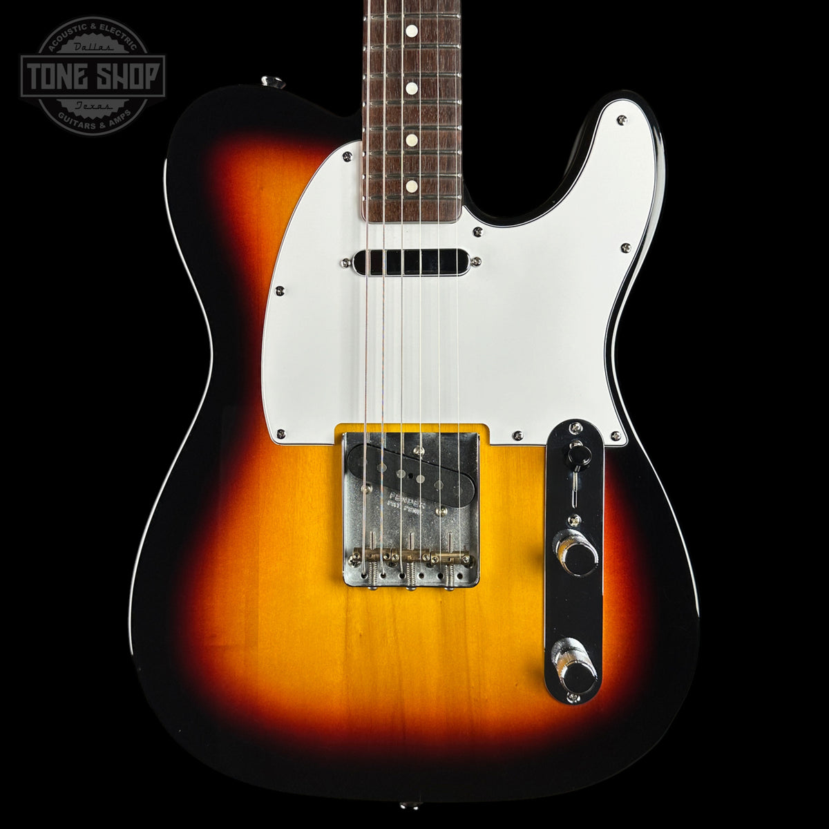 A classic electric guitar with a sunburst finish, featuring a white pickguard, black control plate, and chrome hardware, shown against a solid black background.