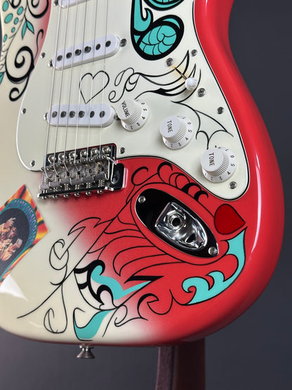 Close-up of a guitar with colorful design and visible hardware