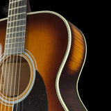 Front detail of Martin Custom Shop 28 Style OM Adirondack/Pacific Big Leaf Flamed Maple Ambertone.
