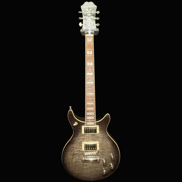 Electric guitar with a sunburst finish on a black background