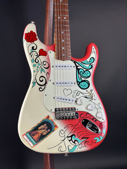 Guitar with colorful designs on a black background