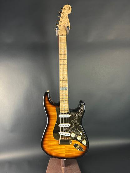 Electric guitar with a sunburst finish on a dark gray background