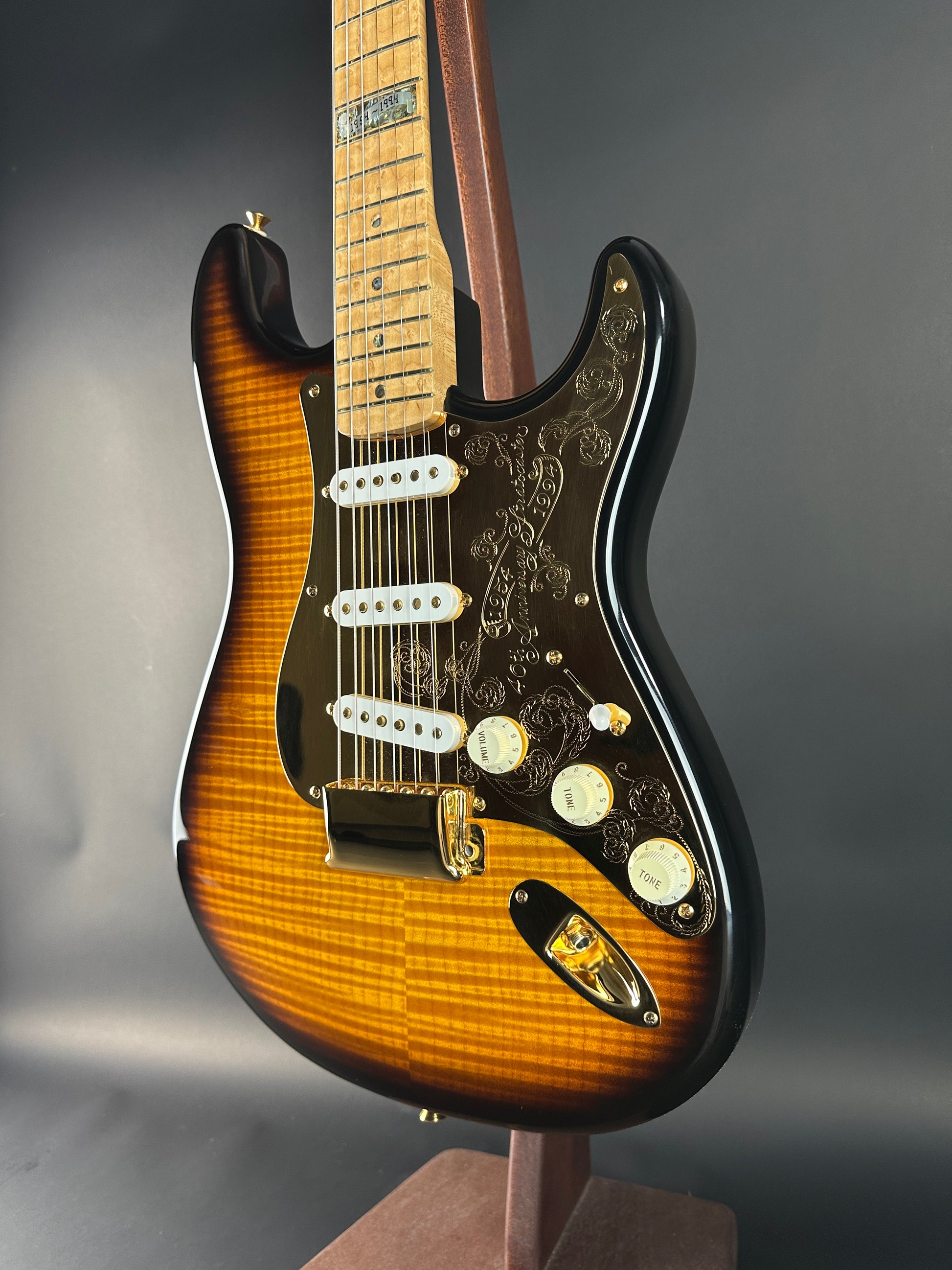 Fender Stratocaster guitar with a sunburst finish on a dark background