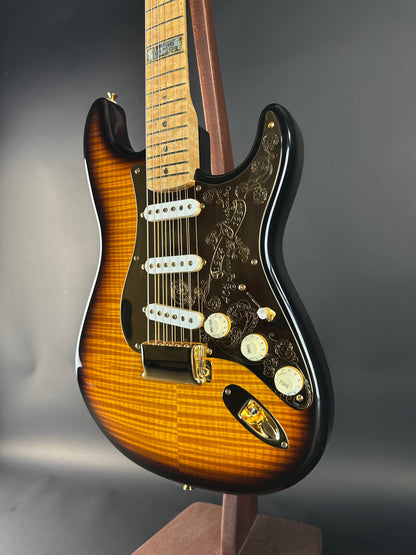 Fender Stratocaster guitar with a sunburst finish on a dark background