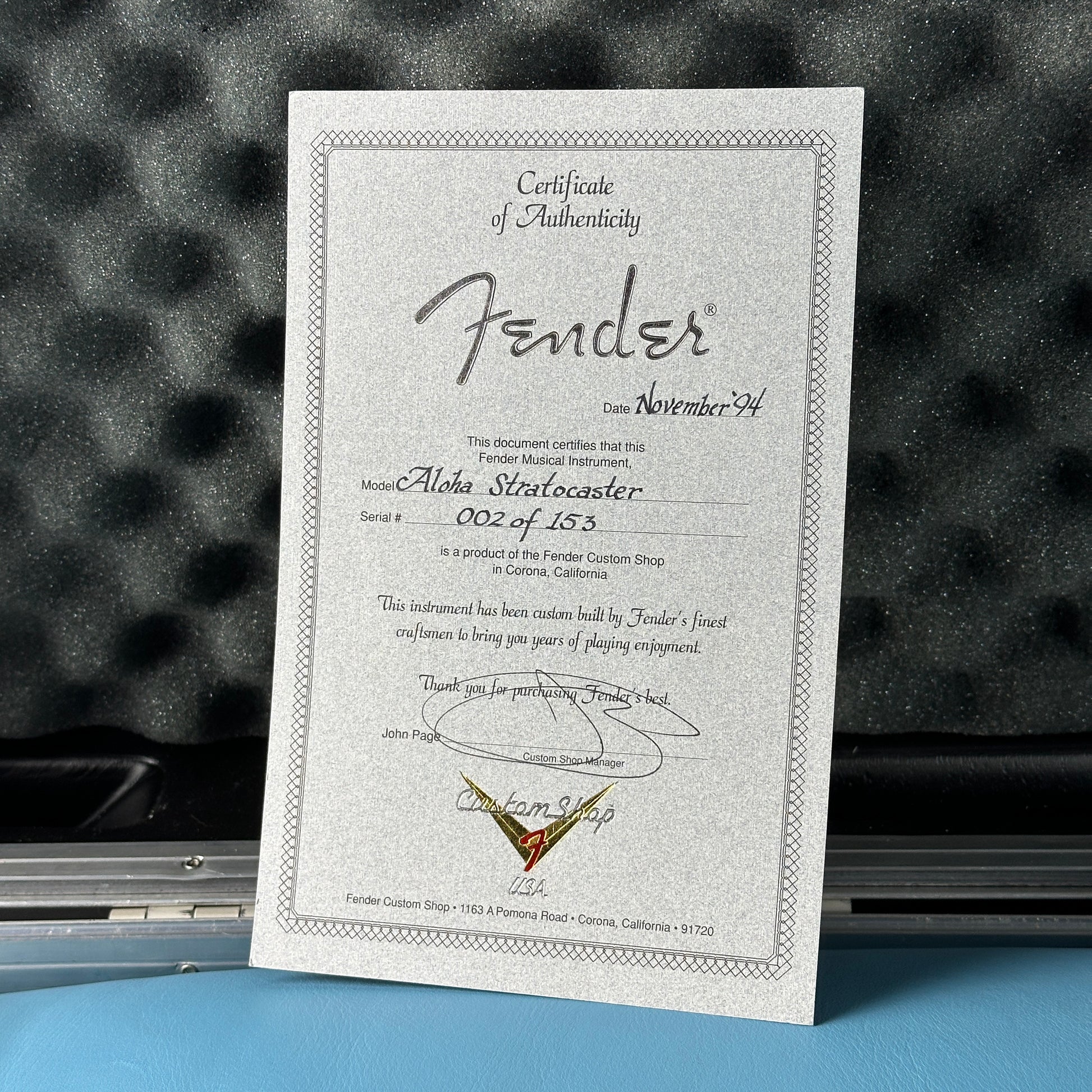Fender certificate of authenticity on a textured surface