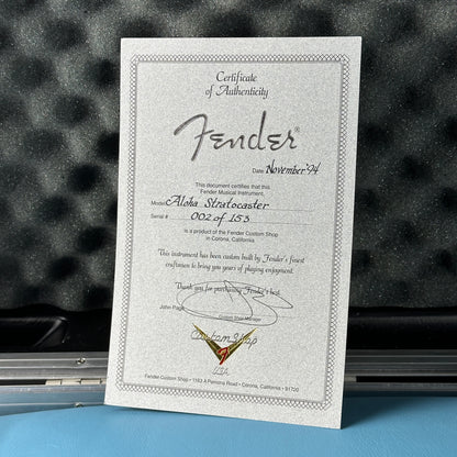 Fender certificate of authenticity on a textured surface