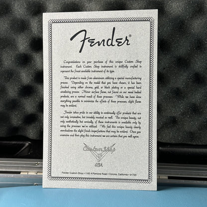 Fender Custom Shop certificate on a guitar with a blurred background