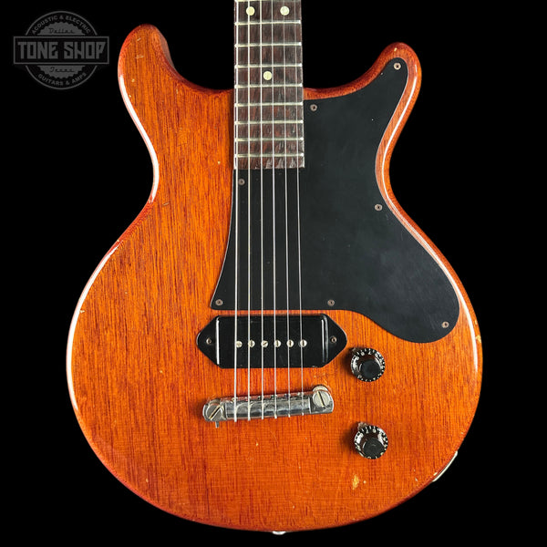 Electric guitar with a sunburst finish on a black background, featuring the Tone Shop logo.