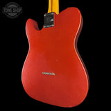 The back view of a Fender Telecaster electric guitar with a bright red body and a yellow neck, shown against a solid black background. A Tone Shop watermark is visible in the top-left corner.