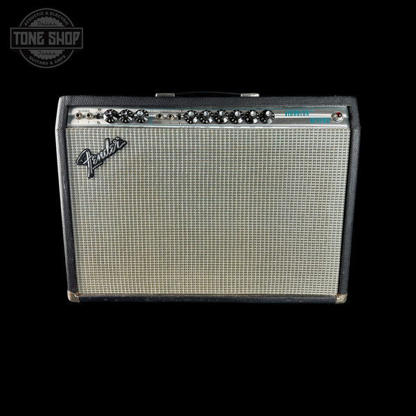 A vintage Fender guitar amplifier with a black cabinet, silver grille, and black controls, shown against a solid black background with a Tone Shop watermark in the top left corner.
