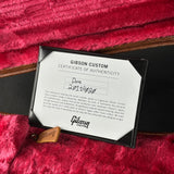 Gibson Custom Certificate of Authenticity on a red textured surface