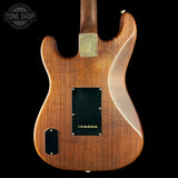 Wooden electric guitar body with a visible brand logo in the corner.