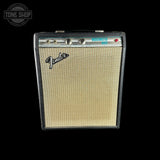 A vintage Fender Music Man guitar amplifier head against a solid black background, featuring a cream-colored grille and black cabinet.