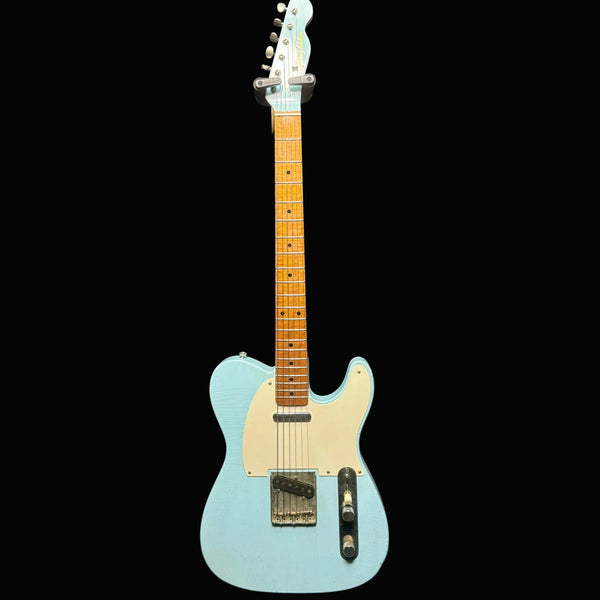 Light blue electric guitar with a black background