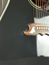 Close-up of a guitar's soundhole and body