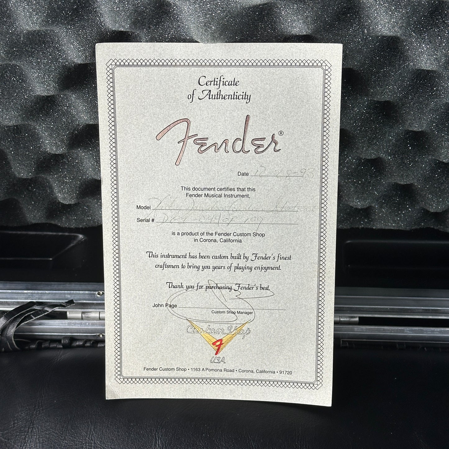 Fender certificate of authenticity on a textured black background