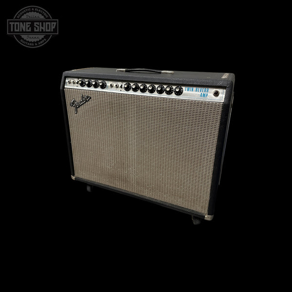 A Fender Jazz Bass AM guitar amplifier with a black cabinet, silver grille, and control knobs, shown against a solid black background with a Tone Shop watermark in the top left corner.