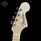 Fender guitar headstock on a black background