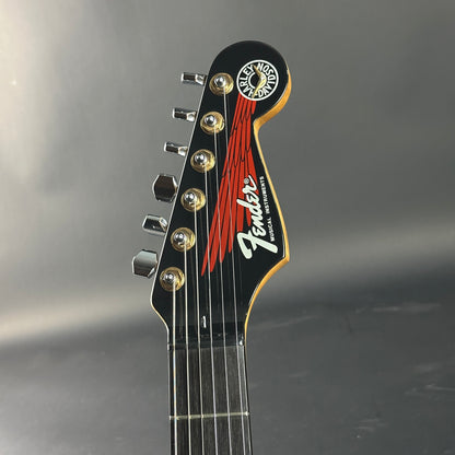 Fender guitar headstock on a gray background
