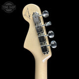 Guitar headstock with tuning pegs on a black background, featuring the 'Tone Shop' logo.