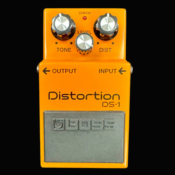 Boss DS-1 distortion pedal on a gray background