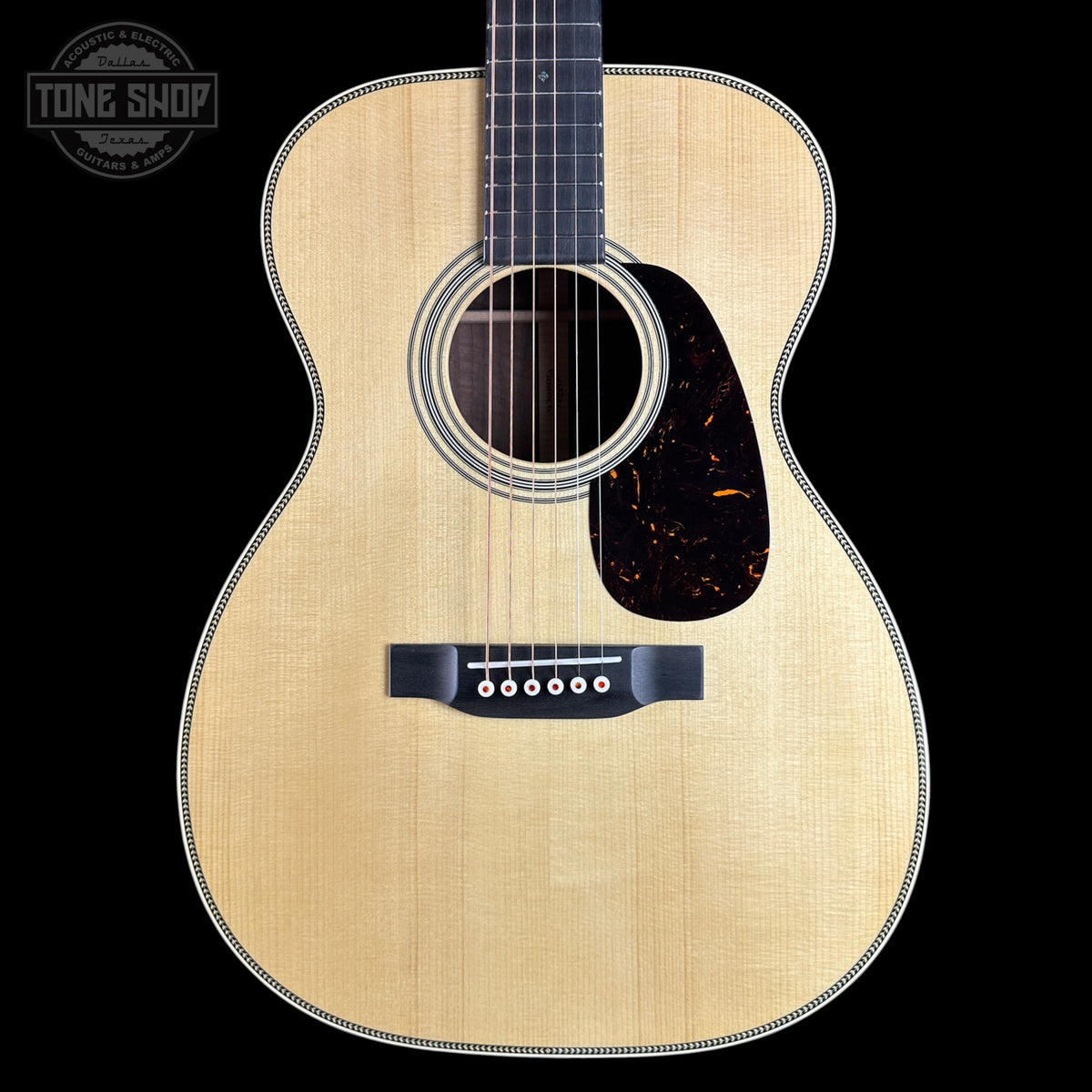 Front of Martin Custom Shop  28 Style 00-14F Adirondack/Bastogne Walnut.