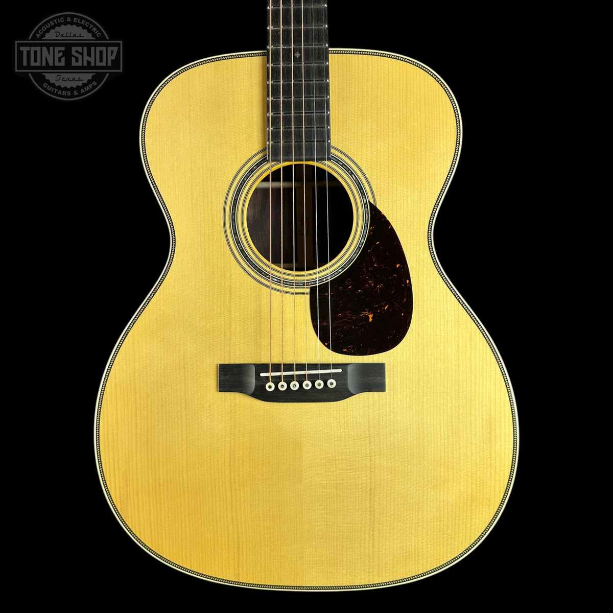 Front of Martin Custom Shop  28/45 Style OM Adirondack/Wild Grain East Indian Rosewood.