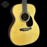 Front angle of Martin Custom Shop  28/45 Style OM Adirondack/Wild Grain East Indian Rosewood.