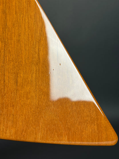 Close-up of a wooden surface with a dark background