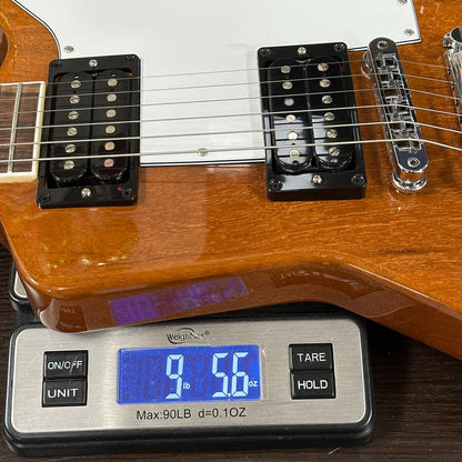 Guitar on a digital scale displaying weight