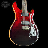 Red electric guitar with a black background