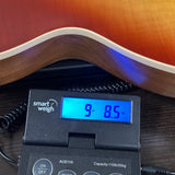 Gibson Les Paul Standard 60s Faded Vintage Bourbon Burst on scale displaying weight.