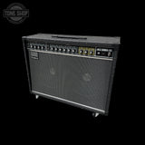 Roland guitar amplifier on a black background with 'Tone Shop' logo.