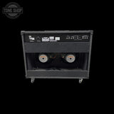 Guitar amplifier with visible brand logo on a black background