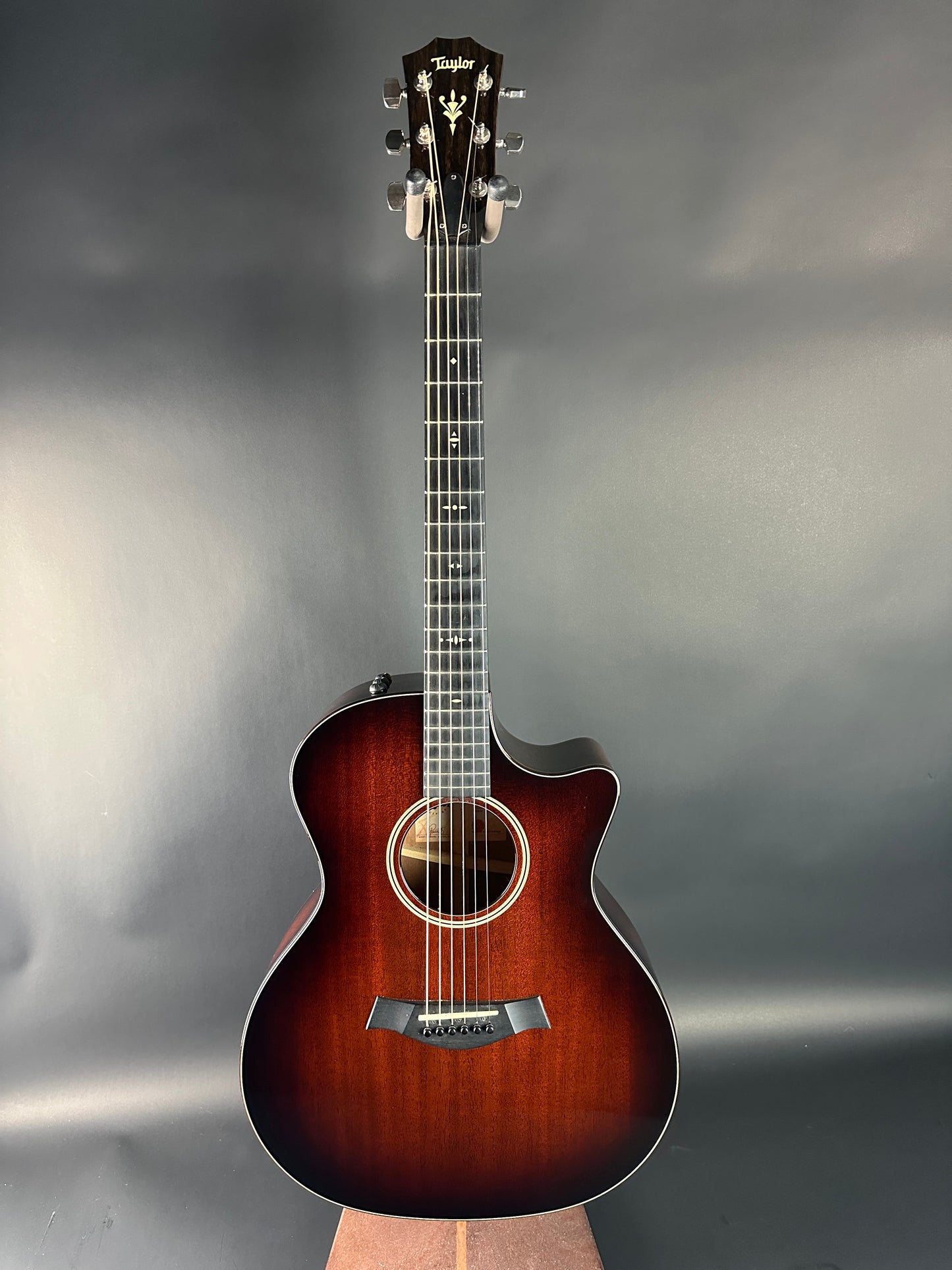Acoustic guitar on a gray background