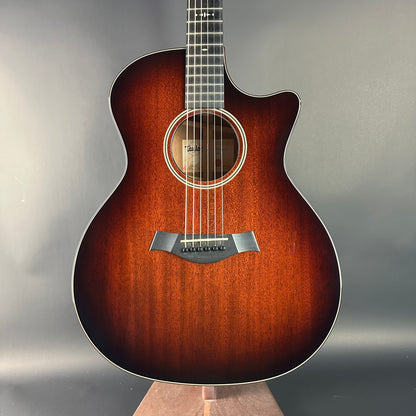 Acoustic guitar with a sunburst finish on a gray background