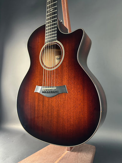 Acoustic guitar with a brown finish on a gray background