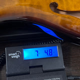 2024 PRS Paul Reed Smith CE24 Semi-Hollow Quilt Black Amber on scale displaying weight.