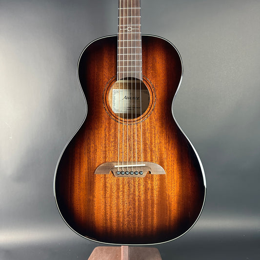 Acoustic guitar with a sunburst finish on a gray background